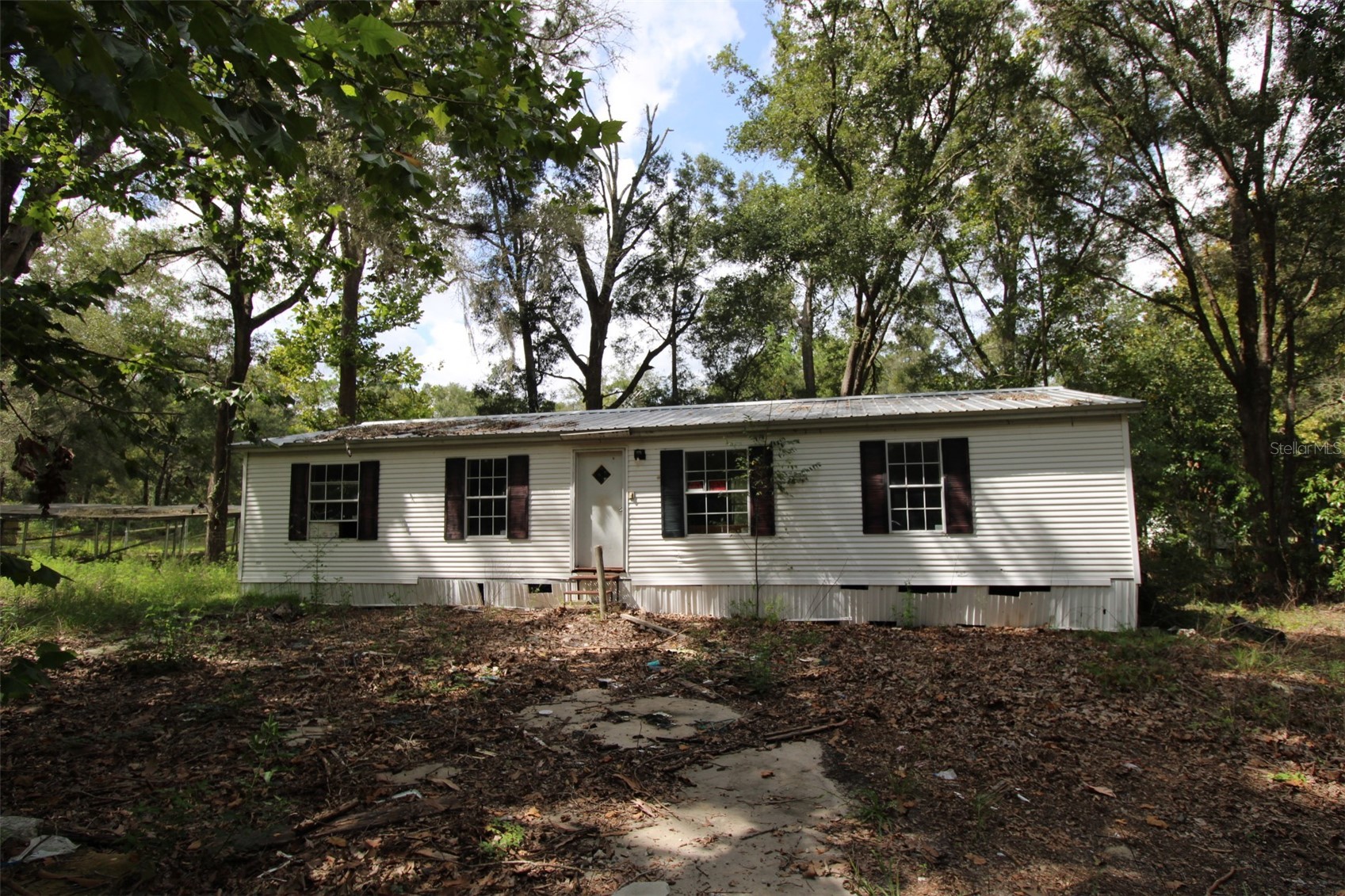9599 NW 56TH LANE
